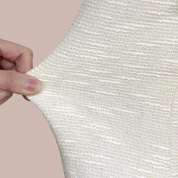 Remarkably lightweight and comfortable. An elegant tweed dress that moves with refined grace.