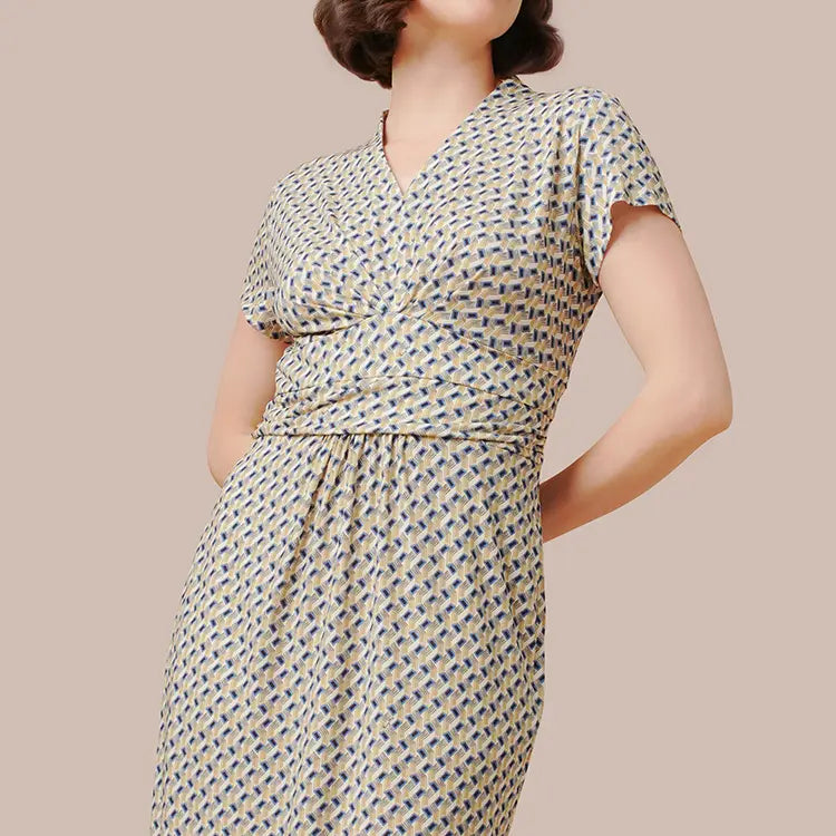 A noble neckline and feminine form dress.