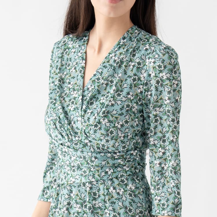 A wraparound and A-line design creates a super feminine impression