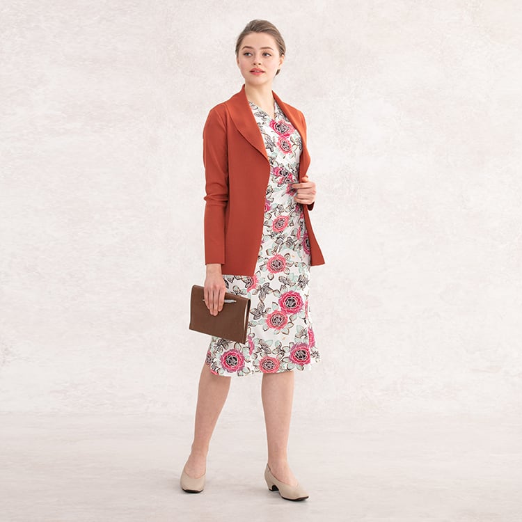 A warm brick-colored cardigan keeps the sweetness to a minimum
