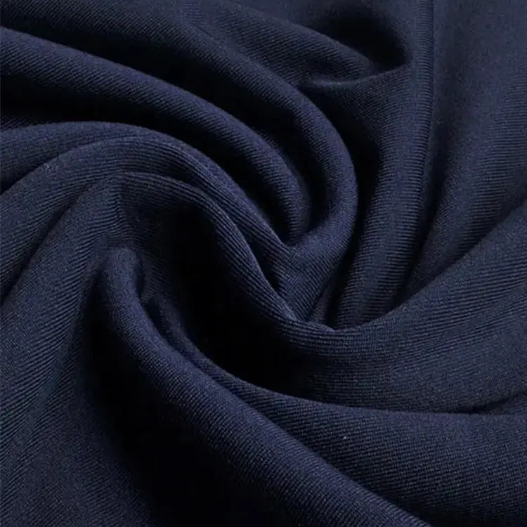 Proprietary high-performance stretch jersey — maintains body warmth while creating exquisite drape lines