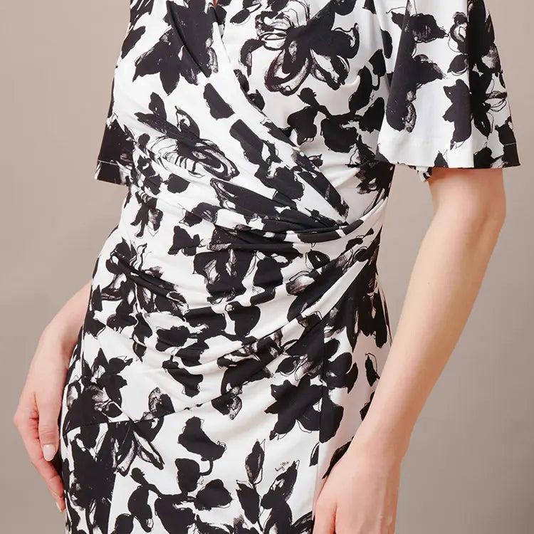 Visual effect of a cinched and curved silhouette.