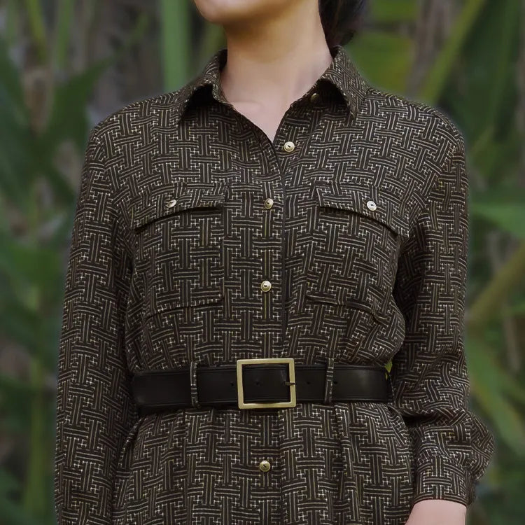 Sophisticated intellectual presence created by gold buttons and elegant black trim