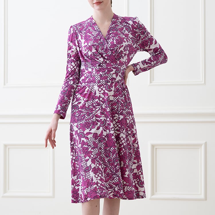 The wrap top and A-line design create a super feminine impression.