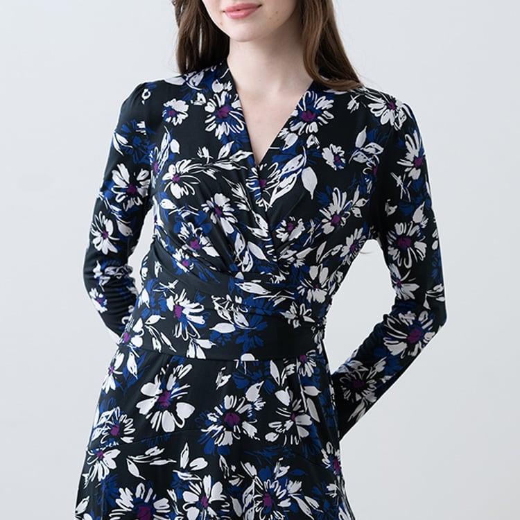 The wrap top and A-line design create a super feminine impression.