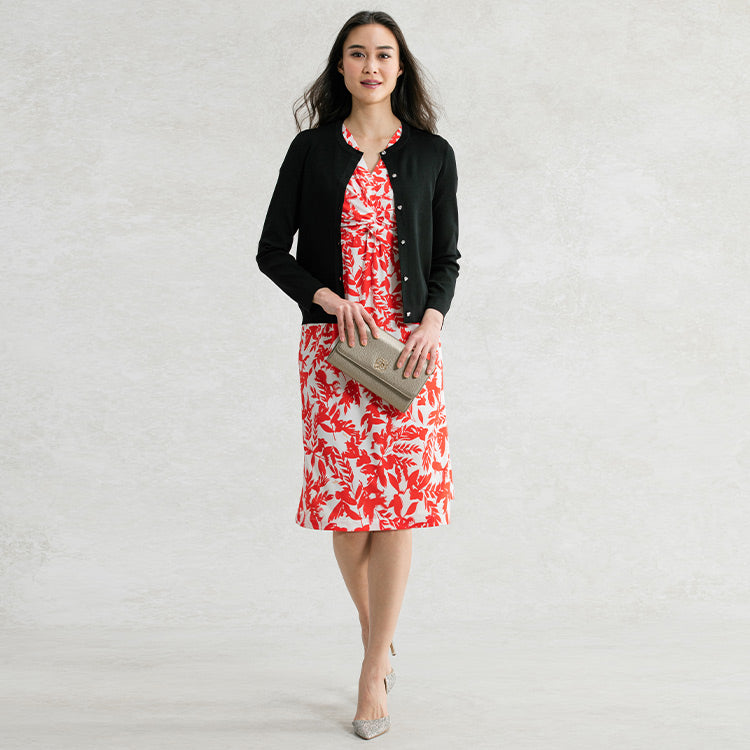 Frame the print with a black cardigan